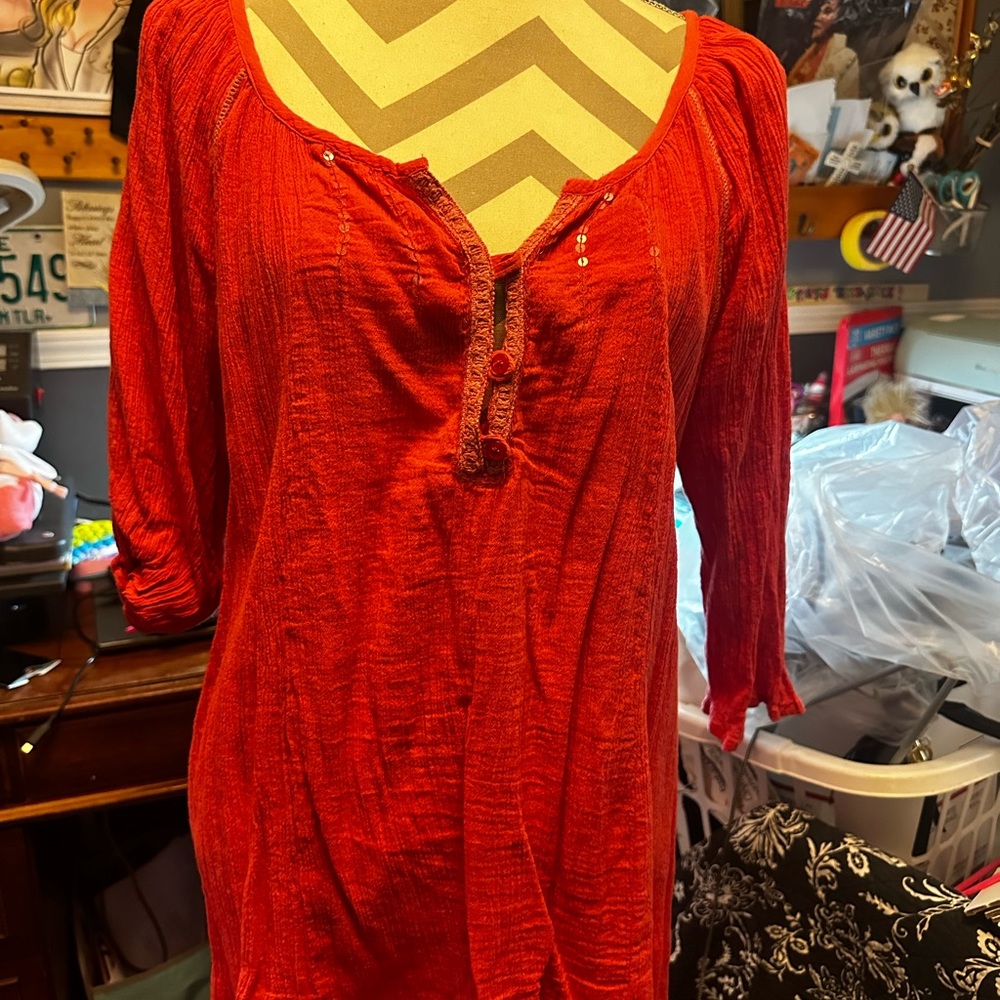 Coral colored woman’s house with buttons and some added bead work
